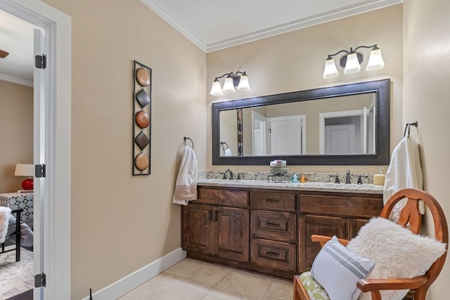 full bath featuring baseboards, a sink, double vanity, and crown molding