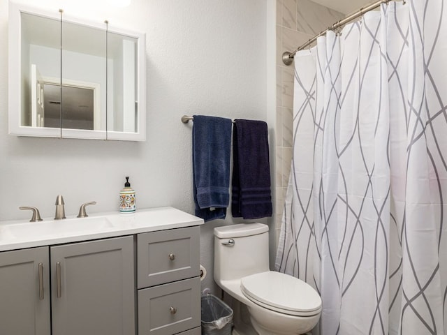 16019 Dark Ln, Austin, TX 78717 - bathroom with vanity, toilet, a shower with shower curtain, and a textured wall