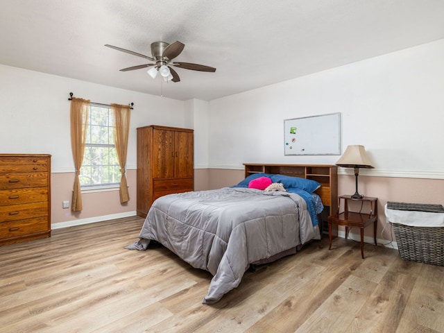 16019 Dark Ln, Austin, TX 78717 - bedroom featuring light wood finished floors, baseboards, and ceiling fan