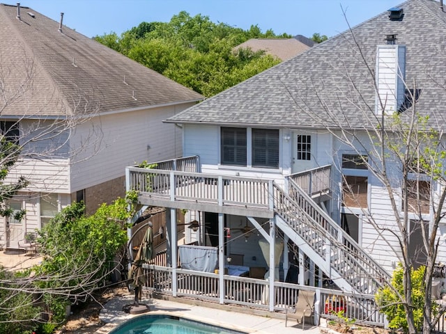 16019 Dark Ln, Austin, TX 78717 - rear view of house featuring a shingled roof, stairway, a wooden deck, a patio, and a chimney