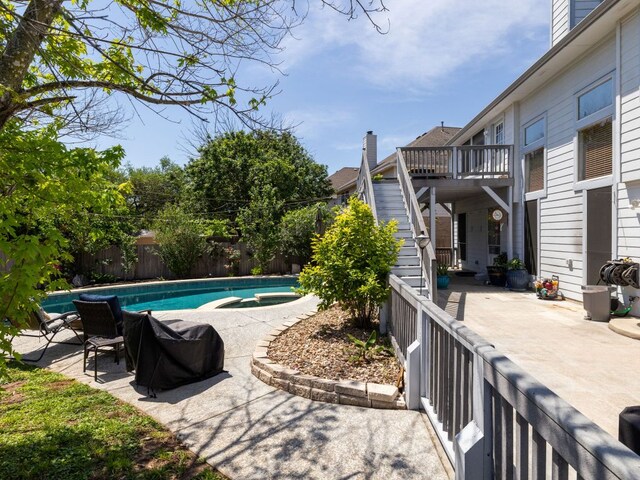 16019 Dark Ln, Austin, TX 78717 - view of pool with a fenced backyard, stairs, a patio, a deck, and a pool with connected hot tub