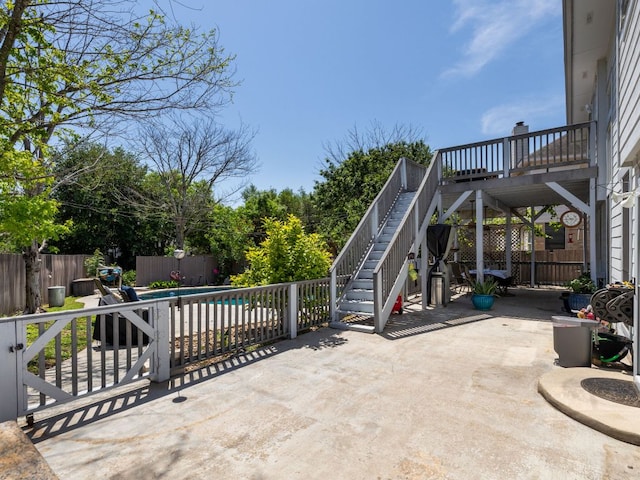 16019 Dark Ln, Austin, TX 78717 - fenced backyard with stairway, a patio area, and a deck