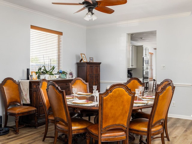 16019 Dark Ln, Austin, TX 78717 - dining room featuring light wood-style floors, a ceiling fan, crown molding, and baseboards
