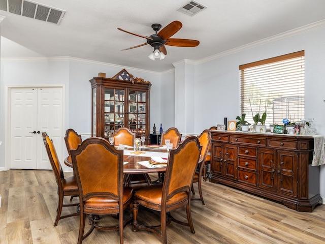 16019 Dark Ln, Austin, TX 78717 - dining room featuring light wood-type flooring, a ceiling fan, and ornamental molding