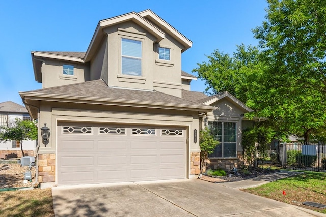 view of front facade with stucco siding, stone siding, and concrete driveway