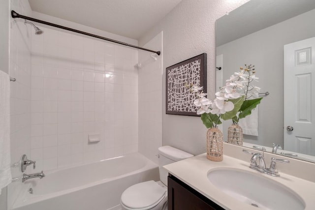 bathroom with washtub / shower combination, toilet, and vanity