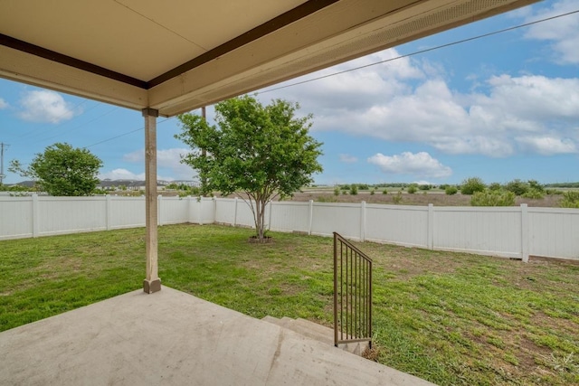 view of yard featuring a patio area and a fenced backyard