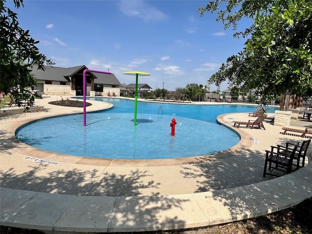 13625 Coomer Path, Pflugerville, TX 78660 - community pool featuring a patio area