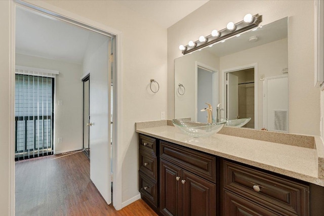 2815 Rio Grande St Unit 211, Austin, TX 78705 - bathroom with wood finished floors and vanity