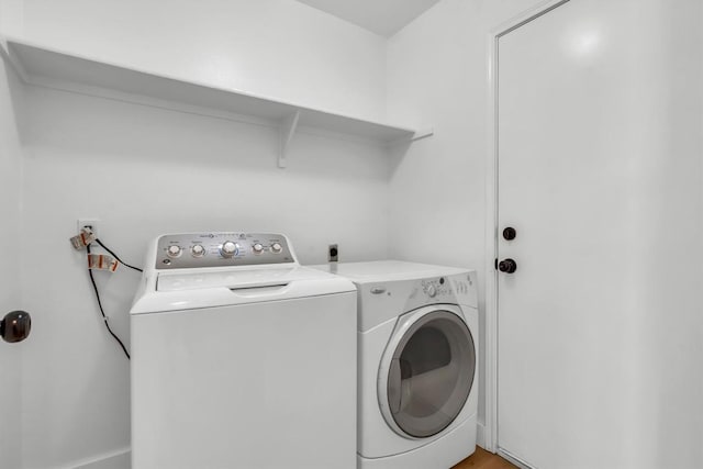 laundry room with washer and clothes dryer and laundry area