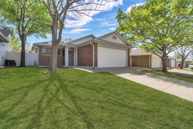 ranch-style home with fence, driveway, brick siding, a front yard, and a garage