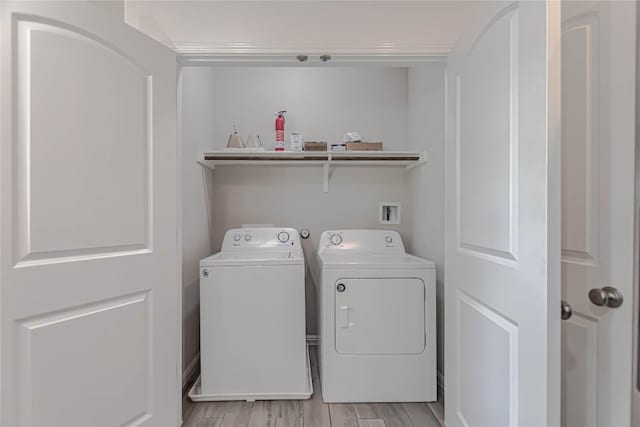2304 S Lakeline Blvd Unit 593, Cedar Park, TX 78613 - laundry area with washer and clothes dryer, laundry area, and light wood-style flooring