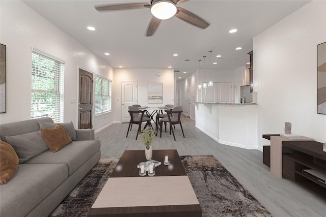 2304 S Lakeline Blvd Unit 593, Cedar Park, TX 78613 - living area with ceiling fan, recessed lighting, light wood-style flooring, and baseboards