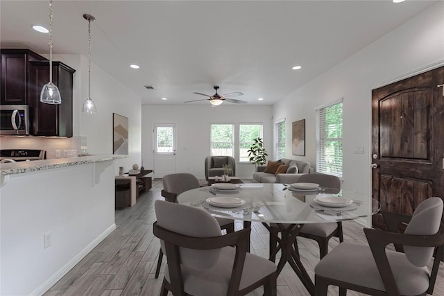 2304 S Lakeline Blvd Unit 593, Cedar Park, TX 78613 - dining room featuring baseboards, recessed lighting, a ceiling fan, and light wood-style floors