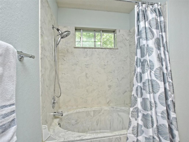 8411 Glen Canyon Dr, Round Rock, TX 78681 - bathroom featuring a combined bath / shower with marble appearance