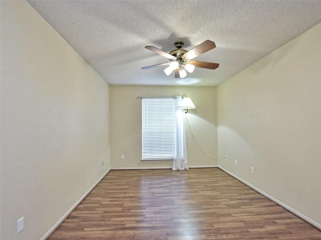 8411 Glen Canyon Dr, Round Rock, TX 78681 - unfurnished room with a ceiling fan, wood finished floors, a textured ceiling, and baseboards