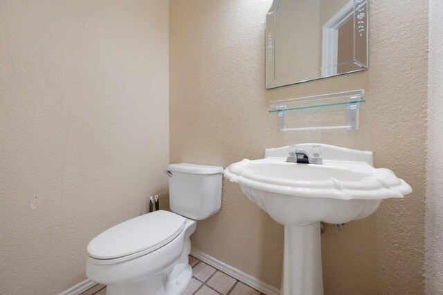 13321 Kirkglen Dr, Austin, TX 78727 - bathroom featuring toilet, tile patterned floors, and baseboards