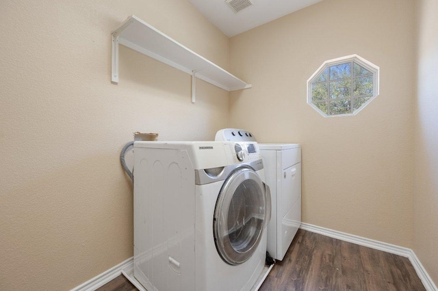 13321 Kirkglen Dr, Austin, TX 78727 - laundry room featuring washing machine and clothes dryer, baseboards, and dark wood-style floors