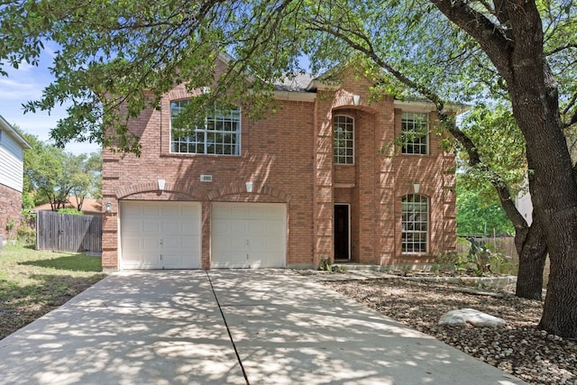 13321 Kirkglen Dr, Austin, TX 78727 - traditional-style home featuring concrete driveway, brick siding, and a garage