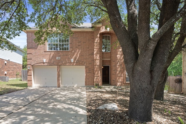 13321 Kirkglen Dr, Austin, TX 78727 - traditional-style house featuring driveway, brick siding, an attached garage, and central AC