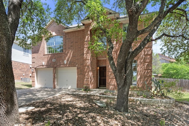 13321 Kirkglen Dr, Austin, TX 78727 - view of front of home featuring brick siding, driveway, and a garage