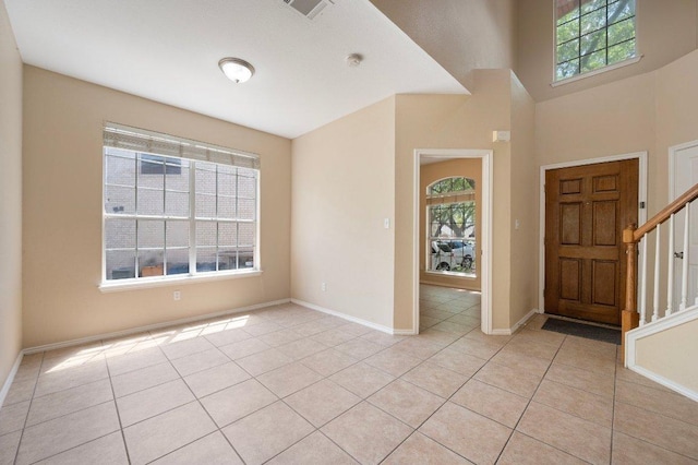 13321 Kirkglen Dr, Austin, TX 78727 - foyer with light tile patterned floors, baseboards, and stairs