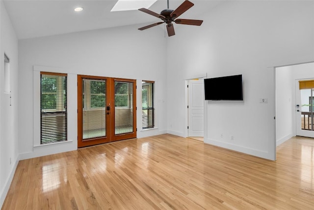 2105 Brackenridge St, Austin, TX 78704 - unfurnished living room featuring french doors, high vaulted ceiling, light wood finished floors, and a ceiling fan
