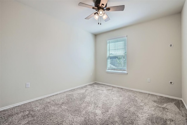 unfurnished room with baseboards, carpet floors, and ceiling fan