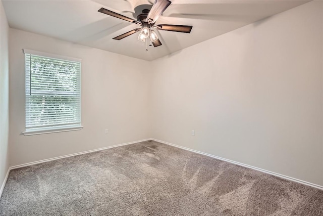 empty room with a ceiling fan, baseboards, and carpet floors