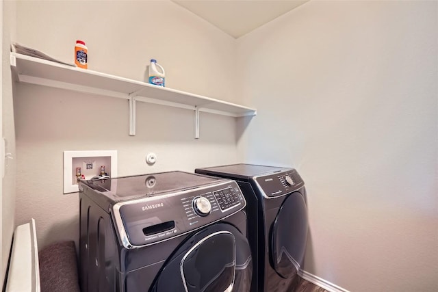 washroom featuring baseboards, laundry area, and independent washer and dryer