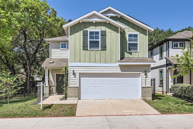 craftsman inspired home with concrete driveway, fence, brick siding, a garage, and board and batten siding