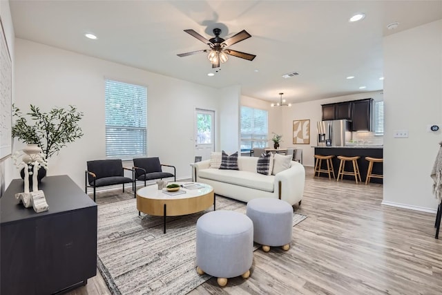 10504 Abana Way, Austin, TX 78748 - living room featuring light wood-type flooring, ceiling fan, and recessed lighting