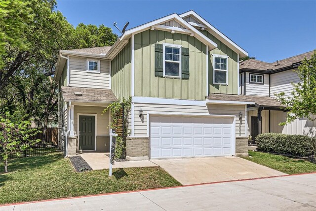 10504 Abana Way, Austin, TX 78748 - view of front of house with board and batten siding, an attached garage, concrete driveway, and a shingled roof