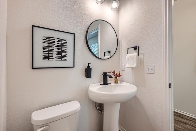 10504 Abana Way, Austin, TX 78748 - half bathroom featuring toilet and wood finished floors