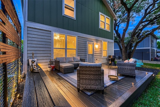 deck featuring an outdoor hangout area and fence