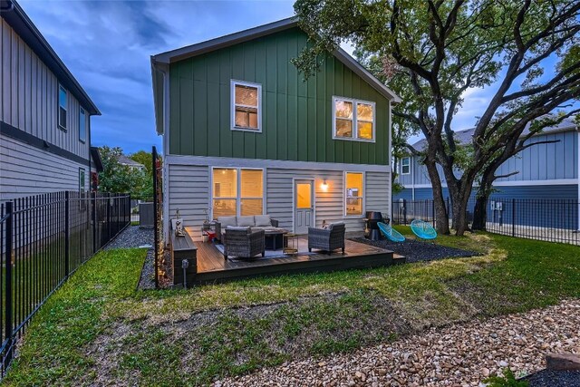 10504 Abana Way, Austin, TX 78748 - back of property with an outdoor hangout area, a wooden deck, board and batten siding, and a fenced backyard