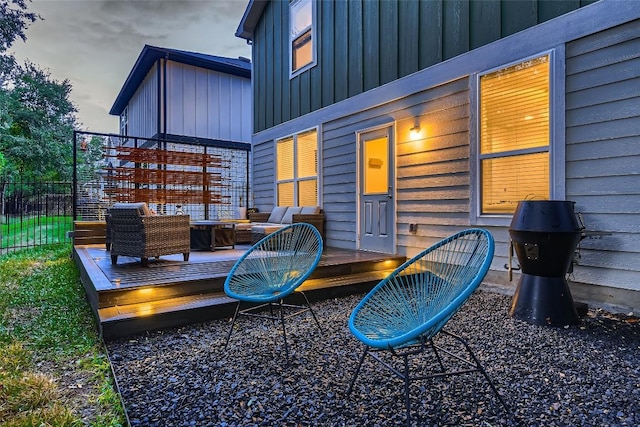 wooden terrace featuring fence and outdoor lounge area