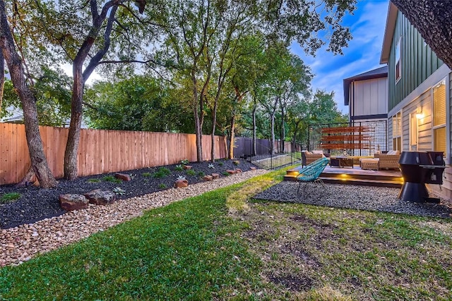view of yard featuring a fenced backyard and a deck