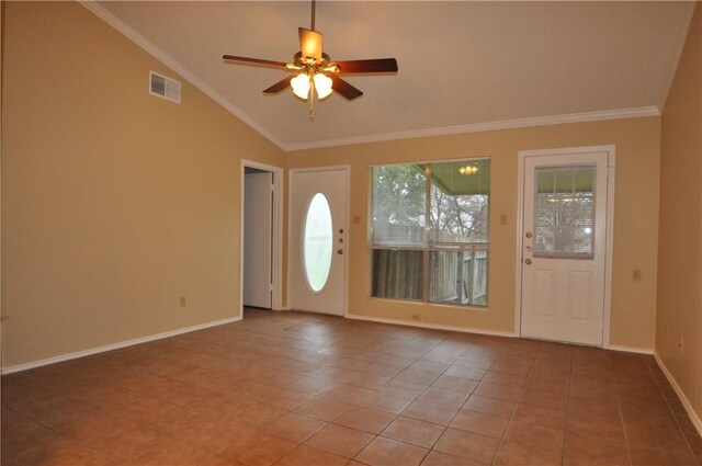 entrance foyer featuring vaulted ceiling, baseboards, a ceiling fan, tile patterned flooring, and crown molding