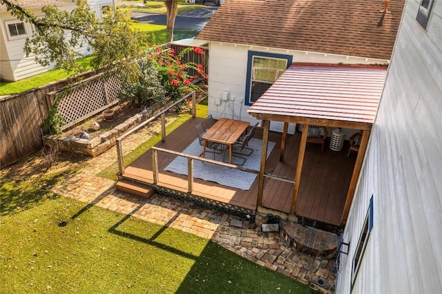 wooden terrace featuring fence