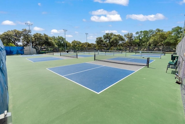 view of sport court with fence