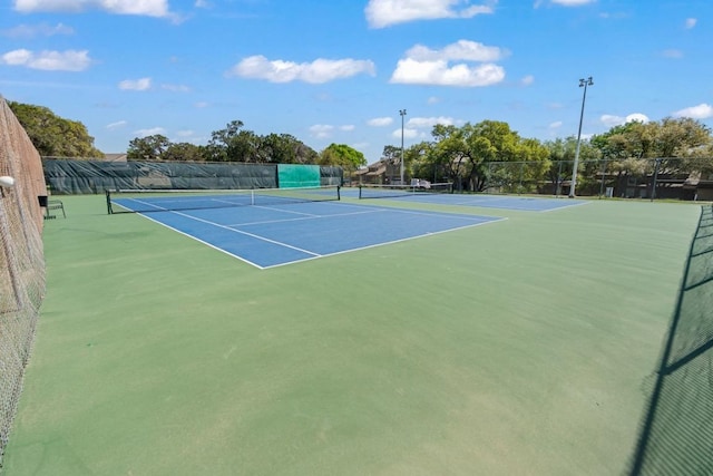 view of sport court with community basketball court and fence