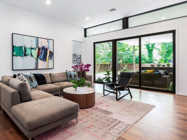 1703 Dexter St, Austin, TX 78704 - living area featuring recessed lighting, visible vents, and wood finished floors