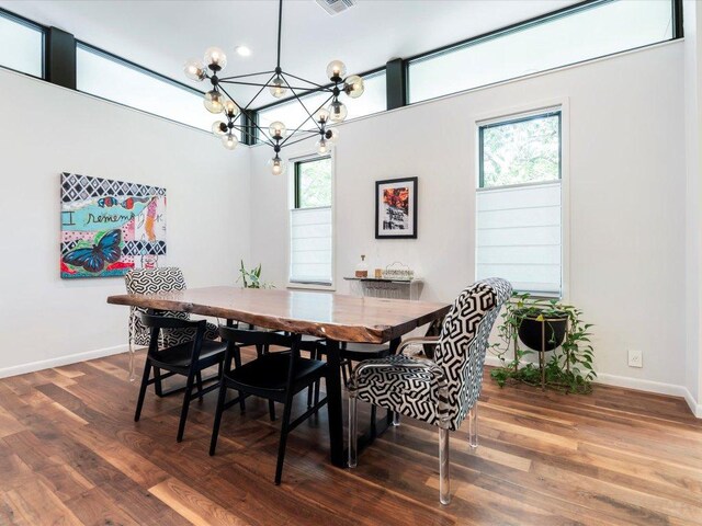 1703 Dexter St, Austin, TX 78704 - dining area with a chandelier, baseboards, visible vents, and wood finished floors