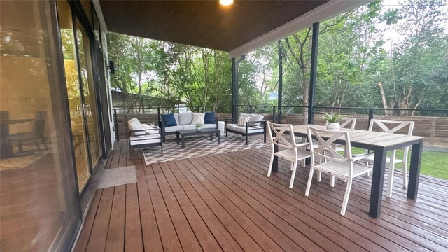 wooden deck featuring an outdoor hangout area