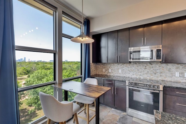 1320 Robert Browning St Unit 409, Austin, TX 78723 - kitchen featuring appliances with stainless steel finishes, tasteful backsplash, and plenty of natural light