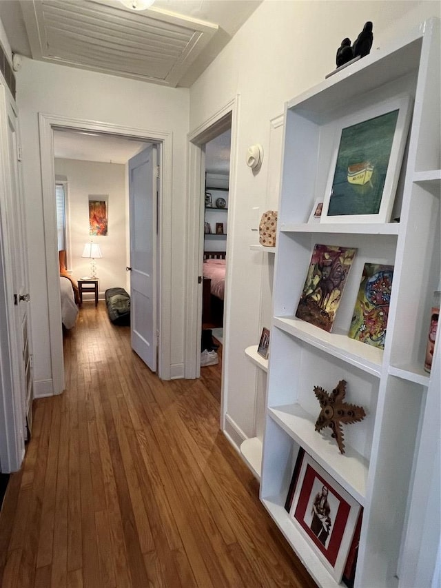 hallway featuring hardwood / wood-style flooring