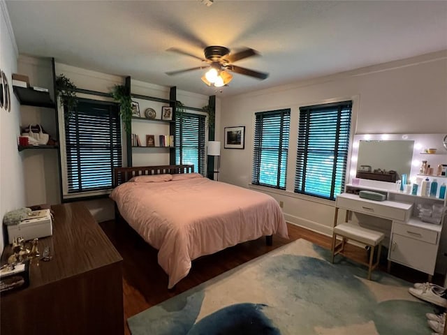 bedroom featuring a ceiling fan and wood finished floors