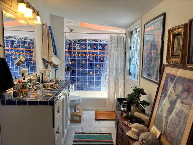 wine area featuring tile patterned flooring and a sink