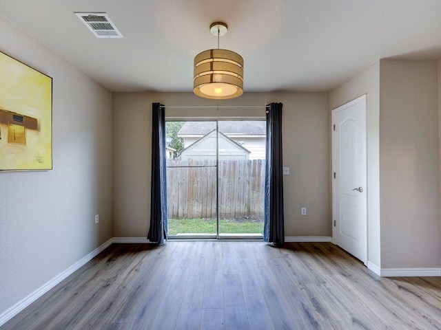 6709 Doyal Dr, Austin, TX 78747 - unfurnished room with wood finished floors and baseboards